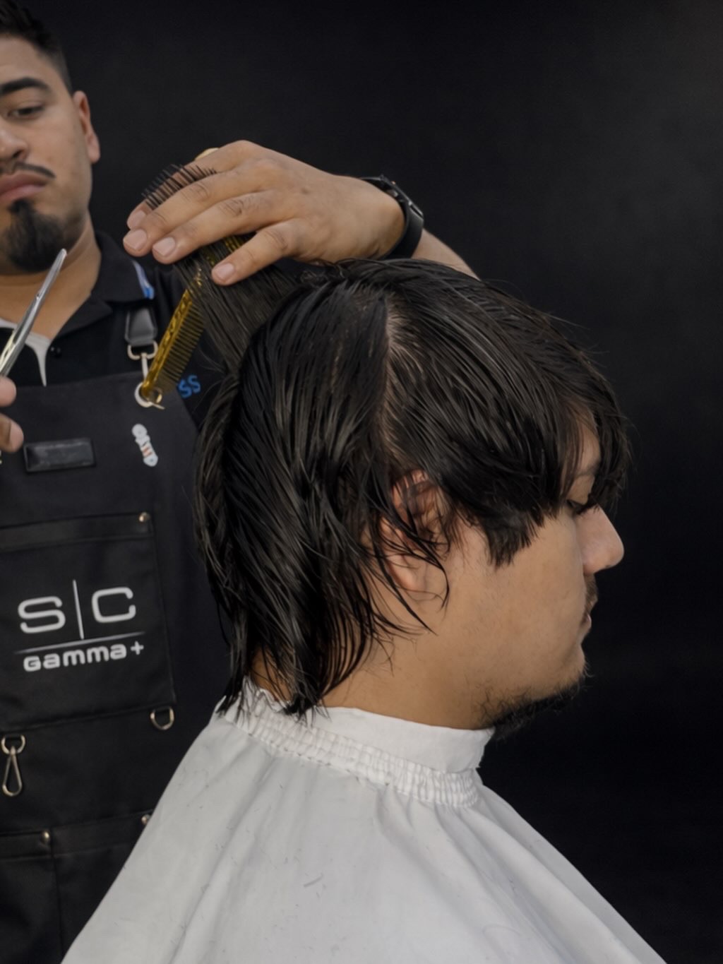 Precision haircut in progress at ZuniCutz
